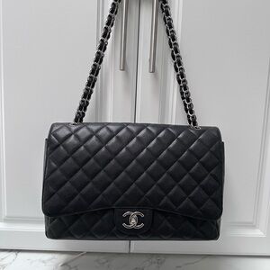 Chanel Double flap Maxi in black caviar leather with silver hardware